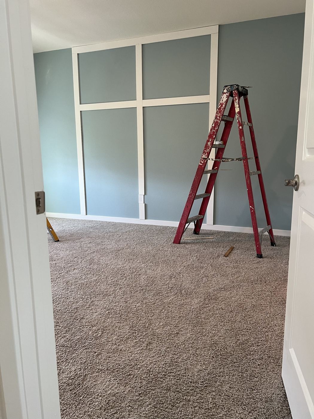 Bedroom wall with trim grid going up