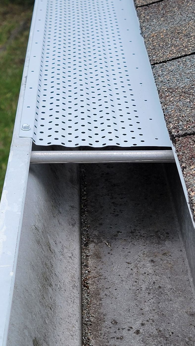 Gutter screen installed on a single-story roof edge