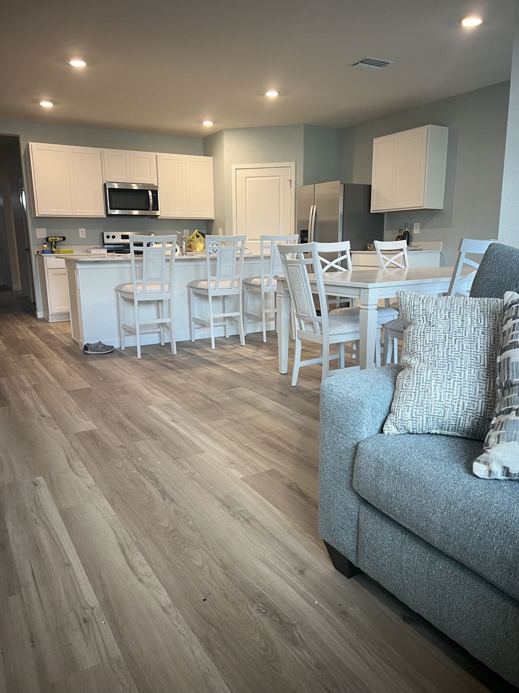 Open kitchen and living area with freshly painted walls
